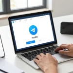Setting up Telegram Chinese language on a laptop in a modern workspace